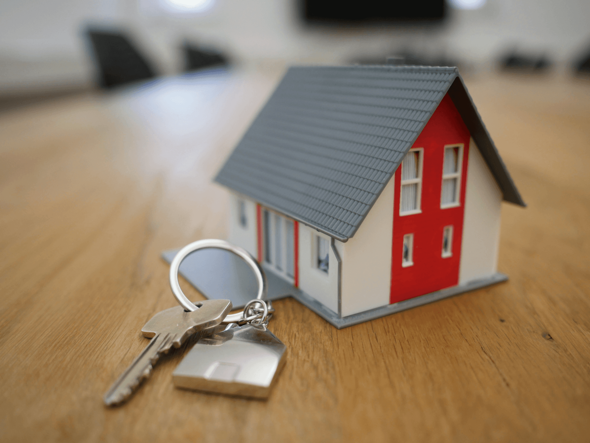 depiction of a pair of keys next to a toy house which hints at what the website is about
